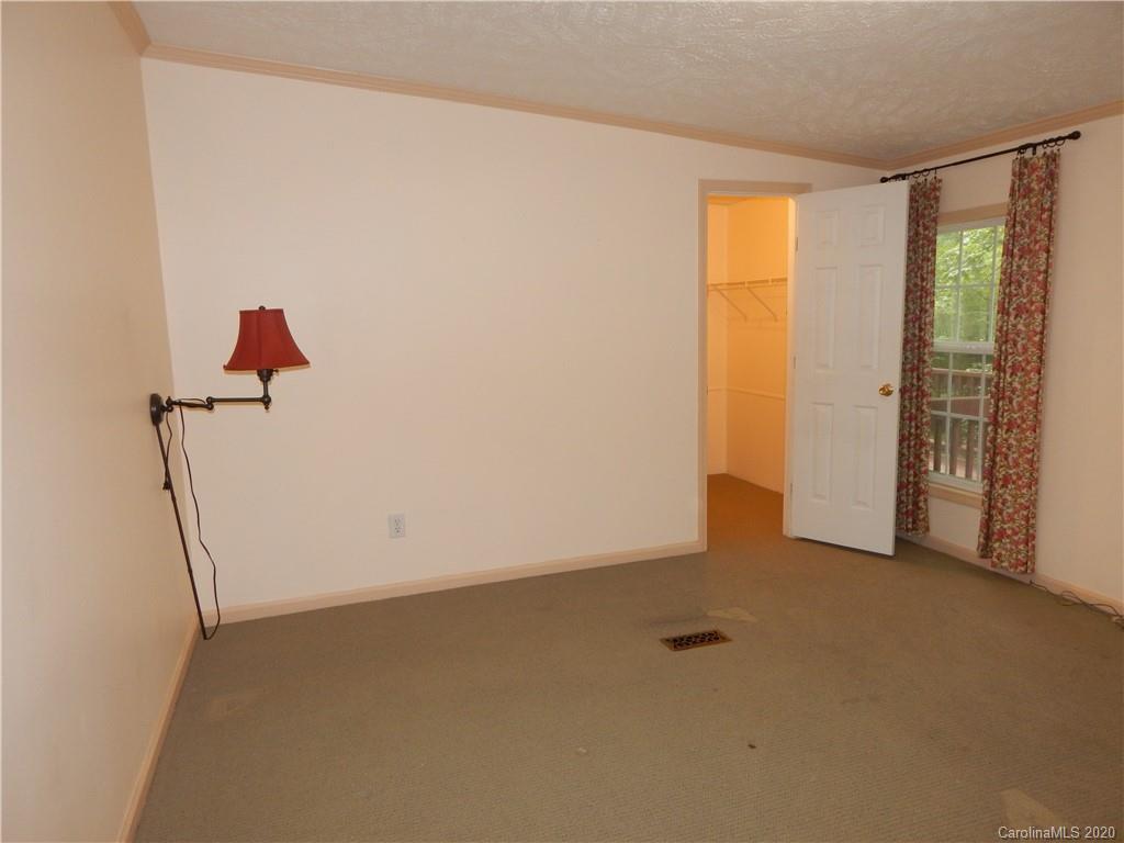 1936 Coopers Gap Road Rutherfordton, NC 28139 - Photo 16 of 32 a view of an empty room with a window