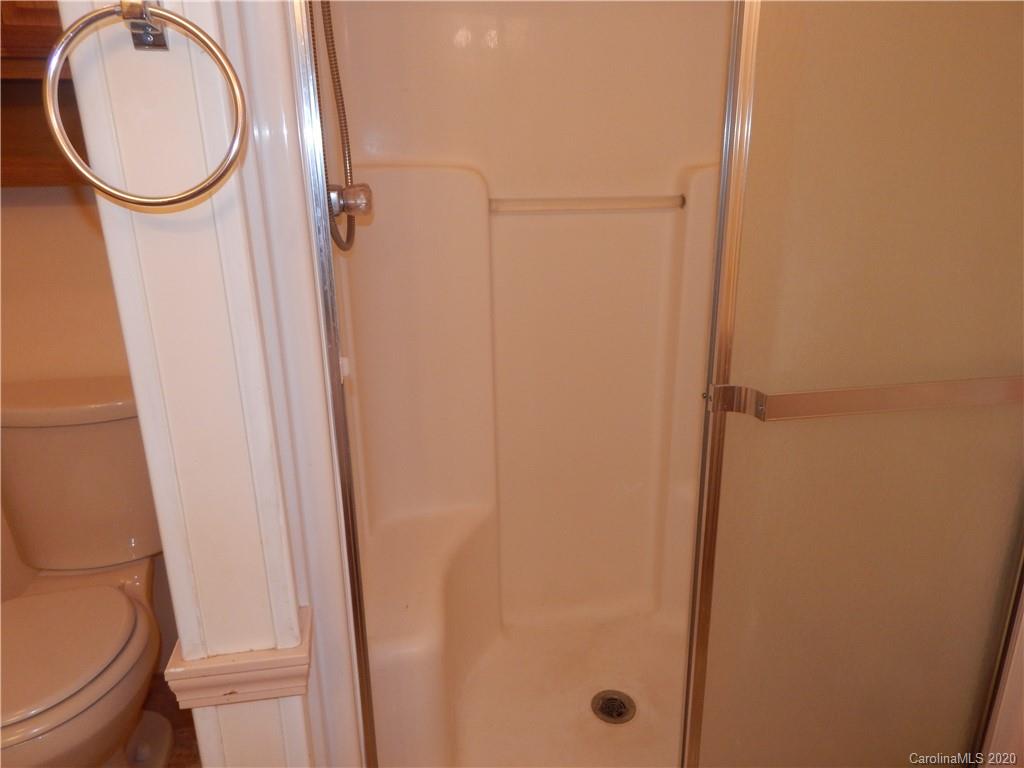 1936 Coopers Gap Road Rutherfordton, NC 28139 - Photo 19 of 32 a bathroom with a toilet and a mirror