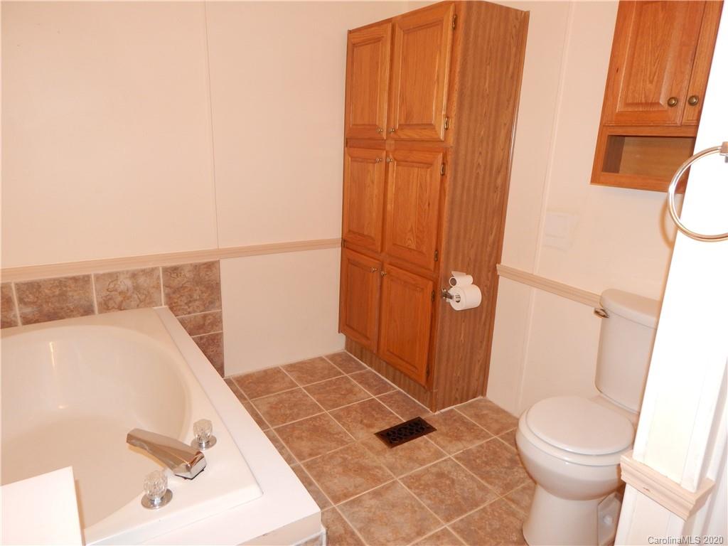 1936 Coopers Gap Road Rutherfordton, NC 28139 - Photo 20 of 32 a bathroom with a sink and toilet