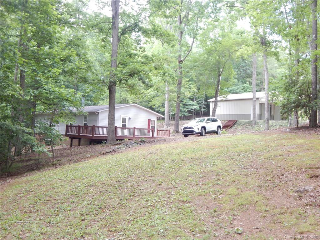 1936 Coopers Gap Road Rutherfordton, NC 28139 - Photo 3 of 32 a white house that has a tree in front of it