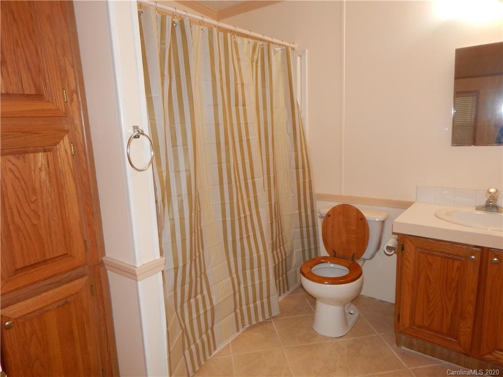 1936 Coopers Gap Road Rutherfordton, NC 28139 - Photo 23 of 32 a bathroom with a toilet and a sink
