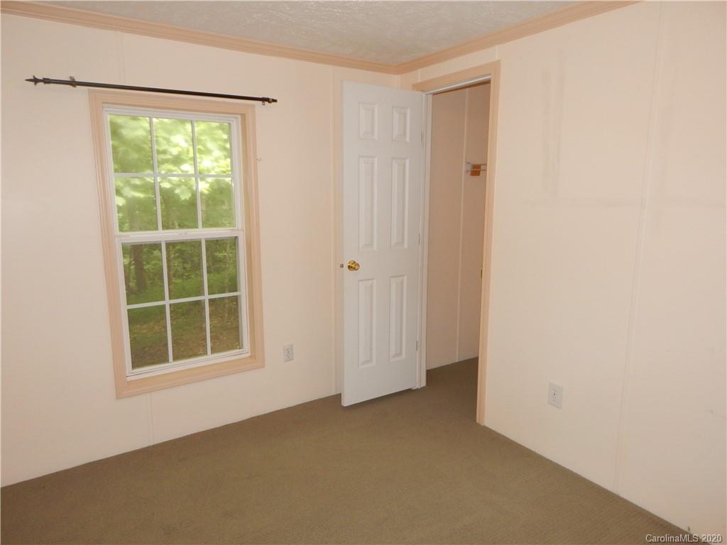 1936 Coopers Gap Road Rutherfordton, NC 28139 - Photo 25 of 32 an empty room with windows