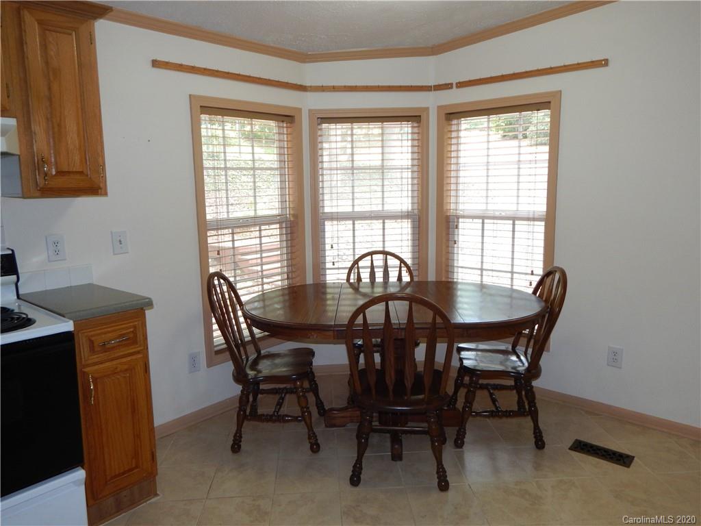1936 Coopers Gap Road Rutherfordton, NC 28139 - Photo 26 of 32 a view of a dining room with furniture and a window
