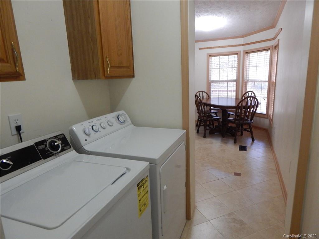 1936 Coopers Gap Road Rutherfordton, NC 28139 - Photo 7 of 32 a utility room with dryer and washer