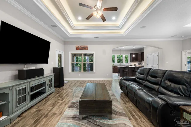 a living room with furniture and a flat screen tv