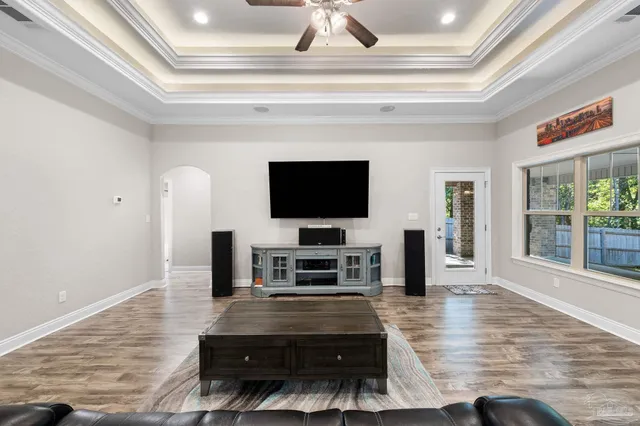 a living room with furniture and a flat screen tv