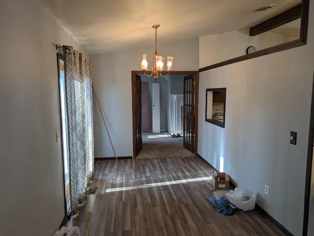 a view of livingroom with hardwood floor and hallway