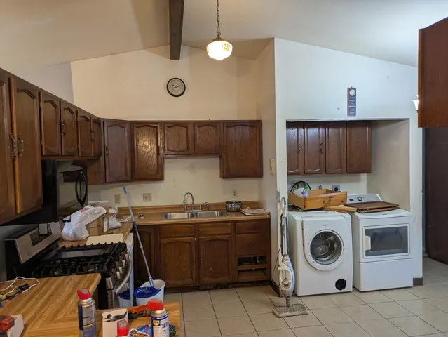 a view of a kitchen with a stove top oven