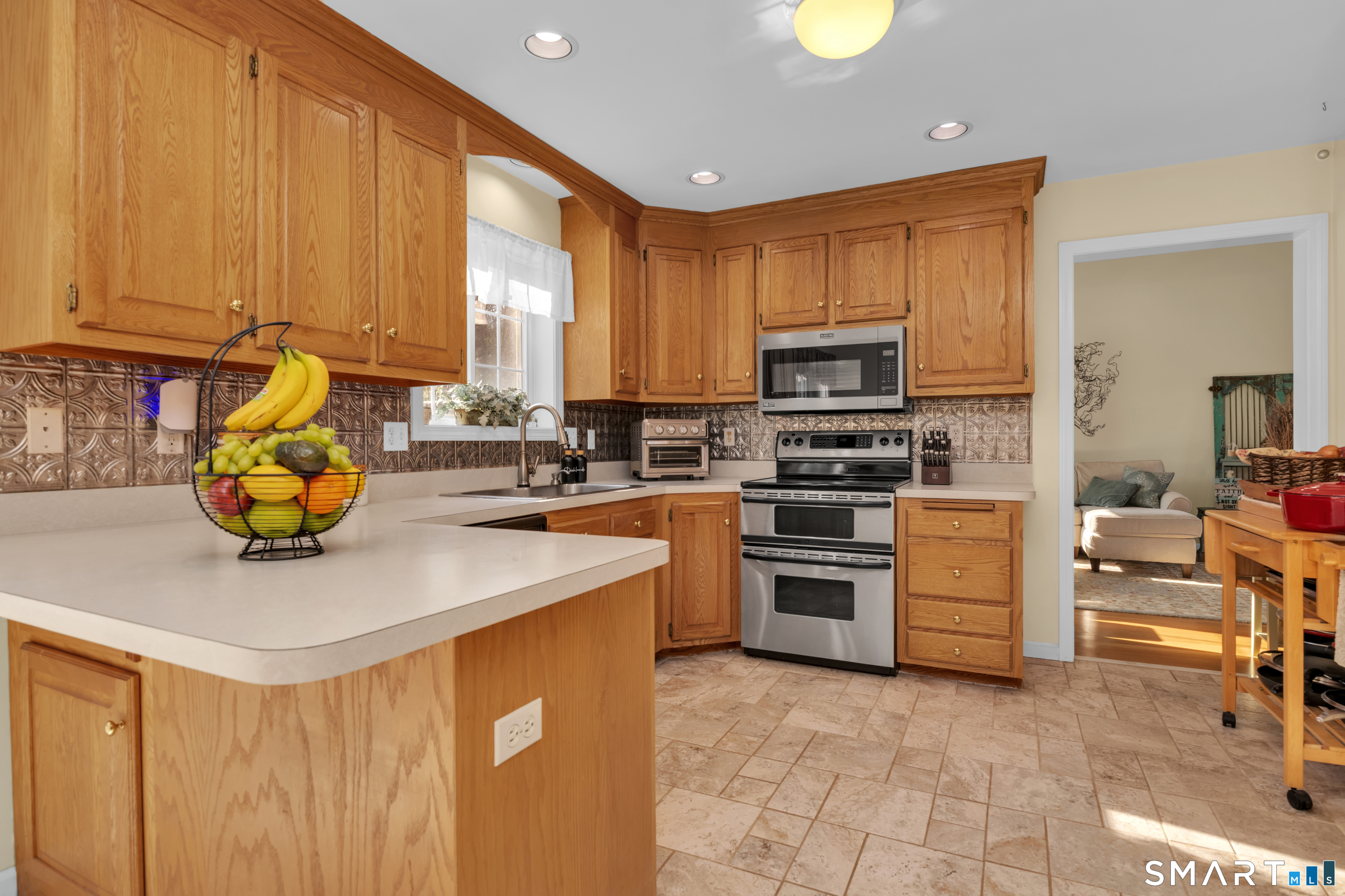 138 Burton Road Beacon Falls, CT 06403 - Photo 13 of 40 a kitchen with stainless steel appliances a stove a sink and a microwave