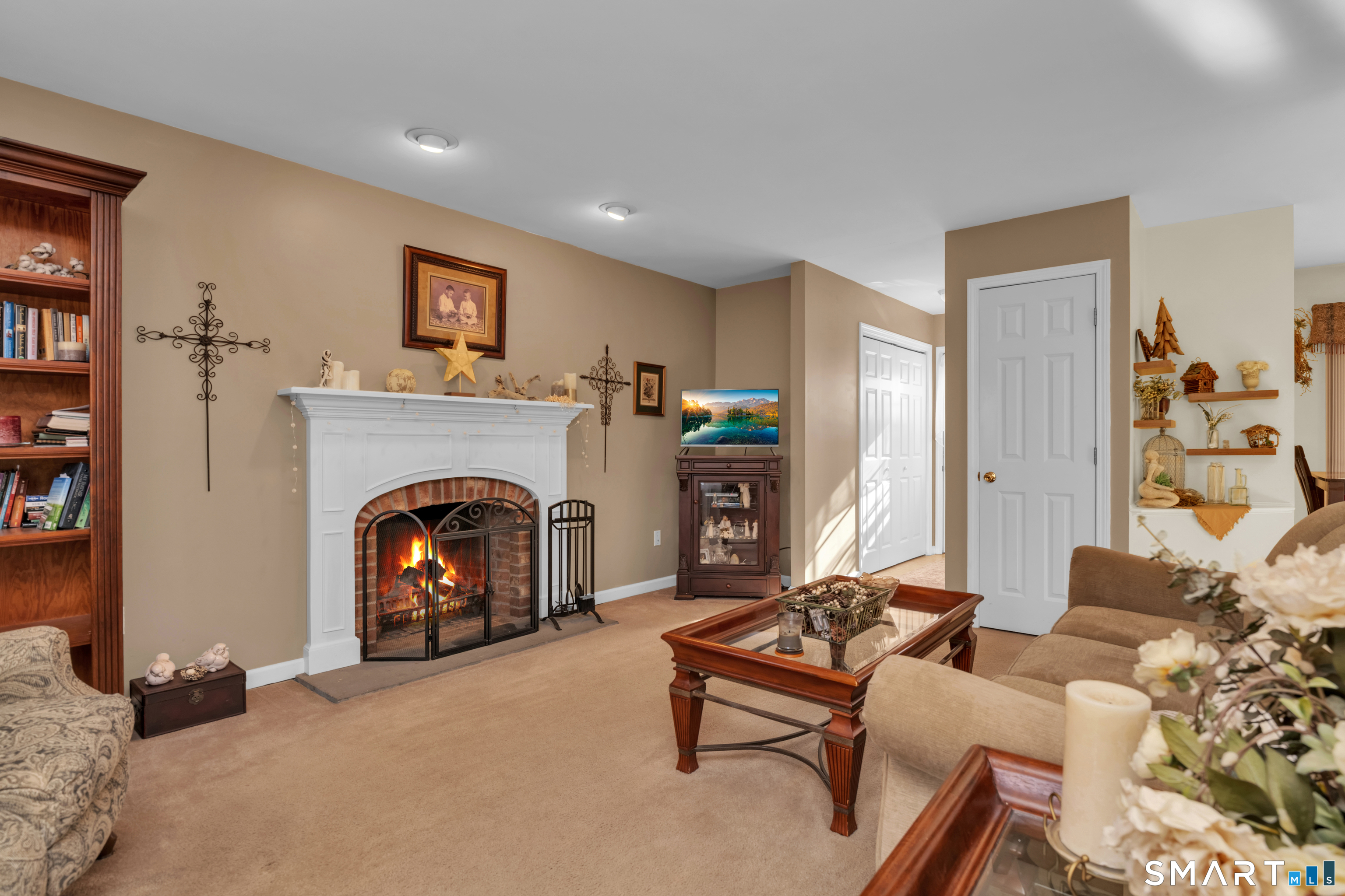 138 Burton Road Beacon Falls, CT 06403 - Photo 19 of 40 a living room with furniture and a fireplace