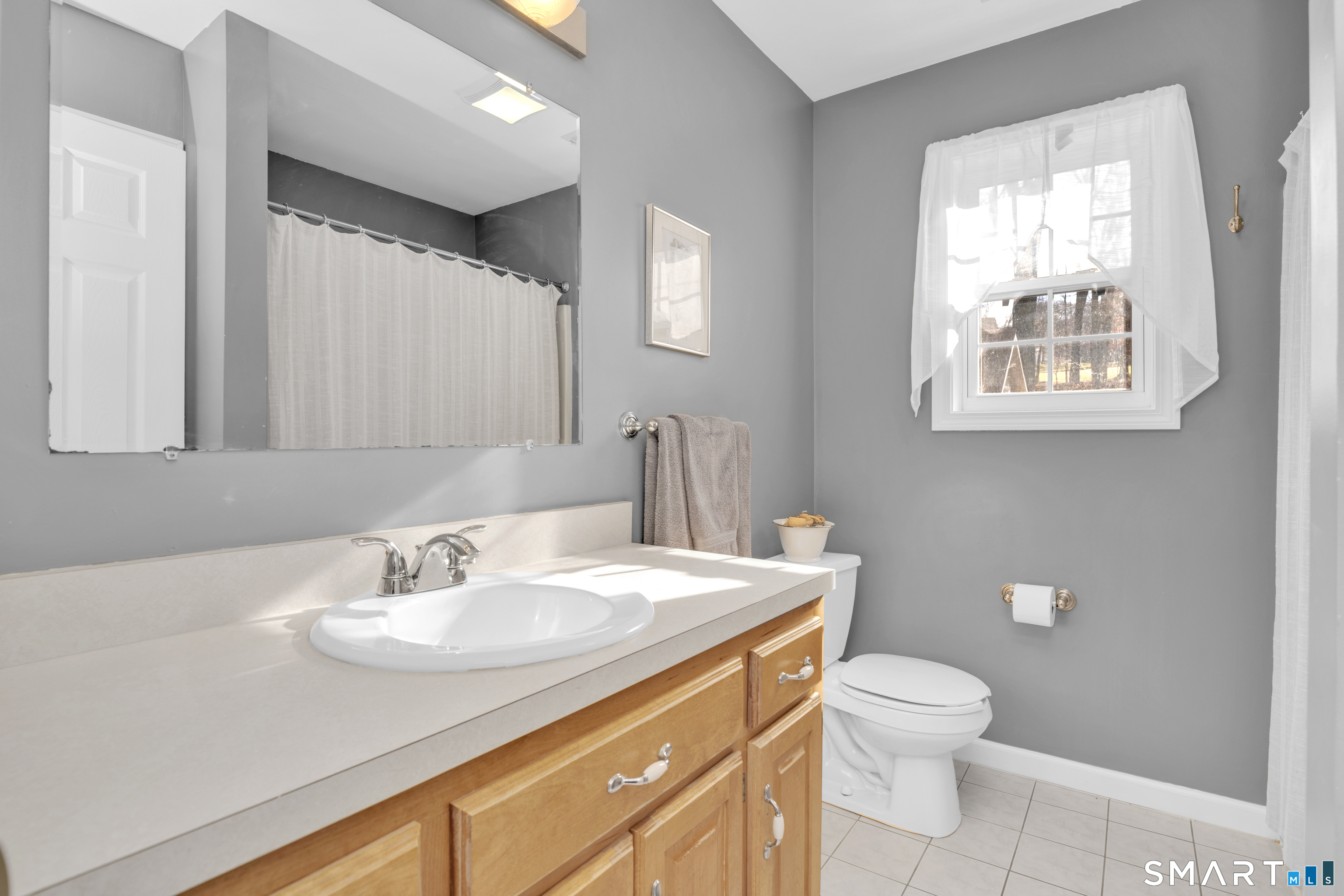 138 Burton Road Beacon Falls, CT 06403 - Photo 33 of 40 a bathroom with a sink toilet and mirror