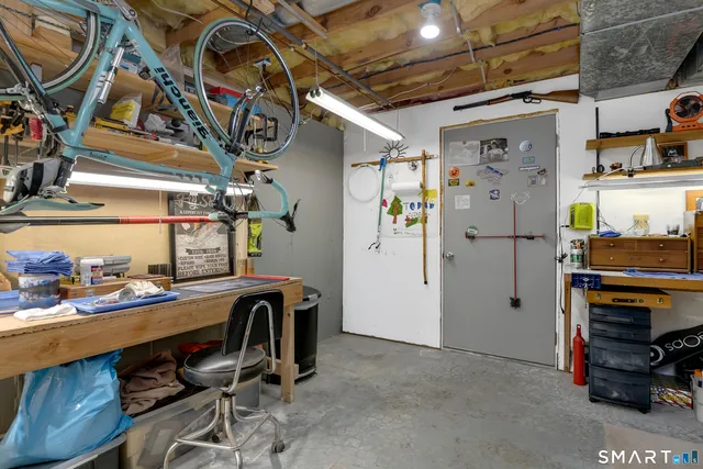 a view of a storage & utility room with racks a window