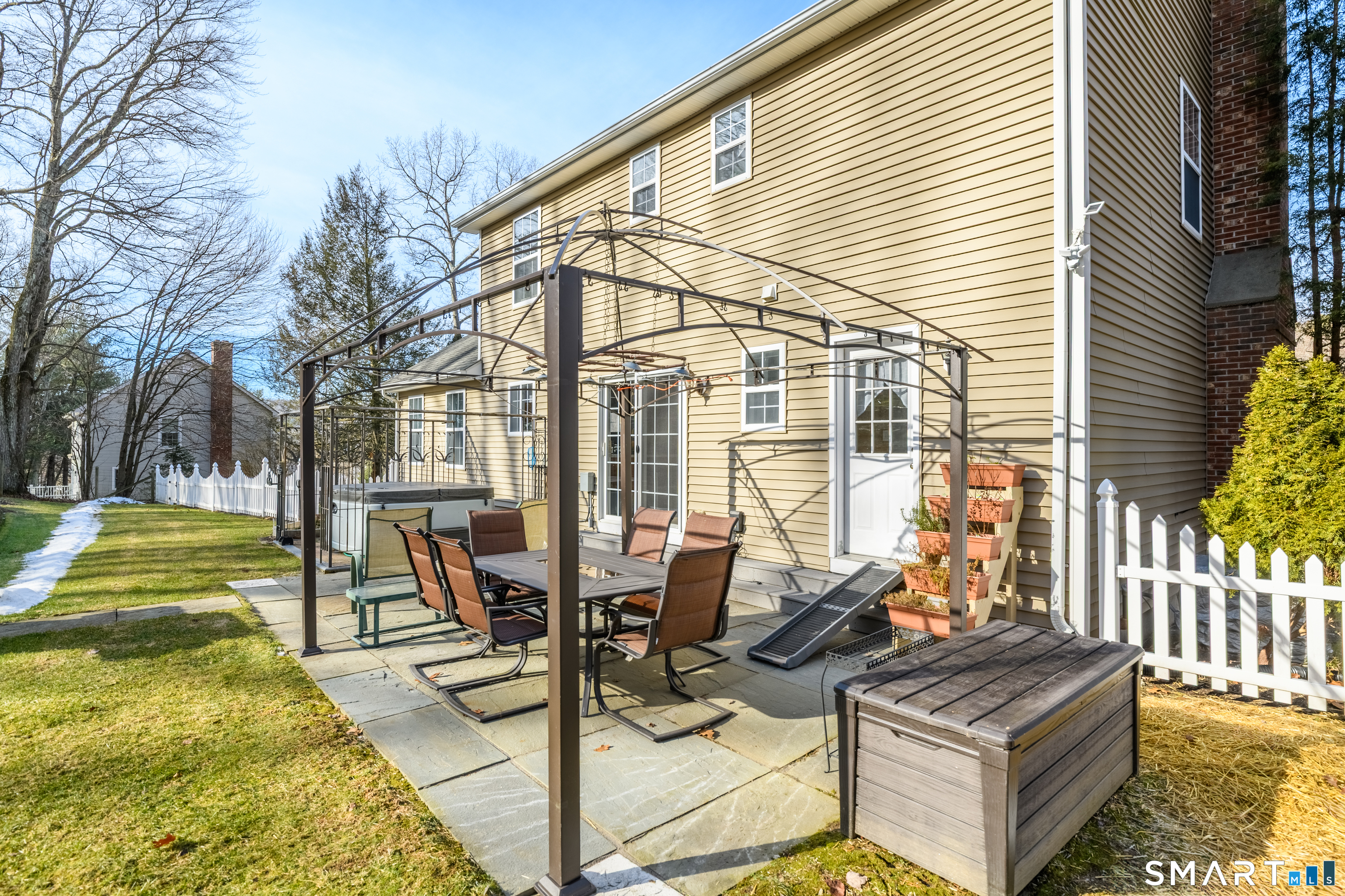 138 Burton Road Beacon Falls, CT 06403 - Photo 36 of 40 a view of a patio with table and chairs and wooden fence
