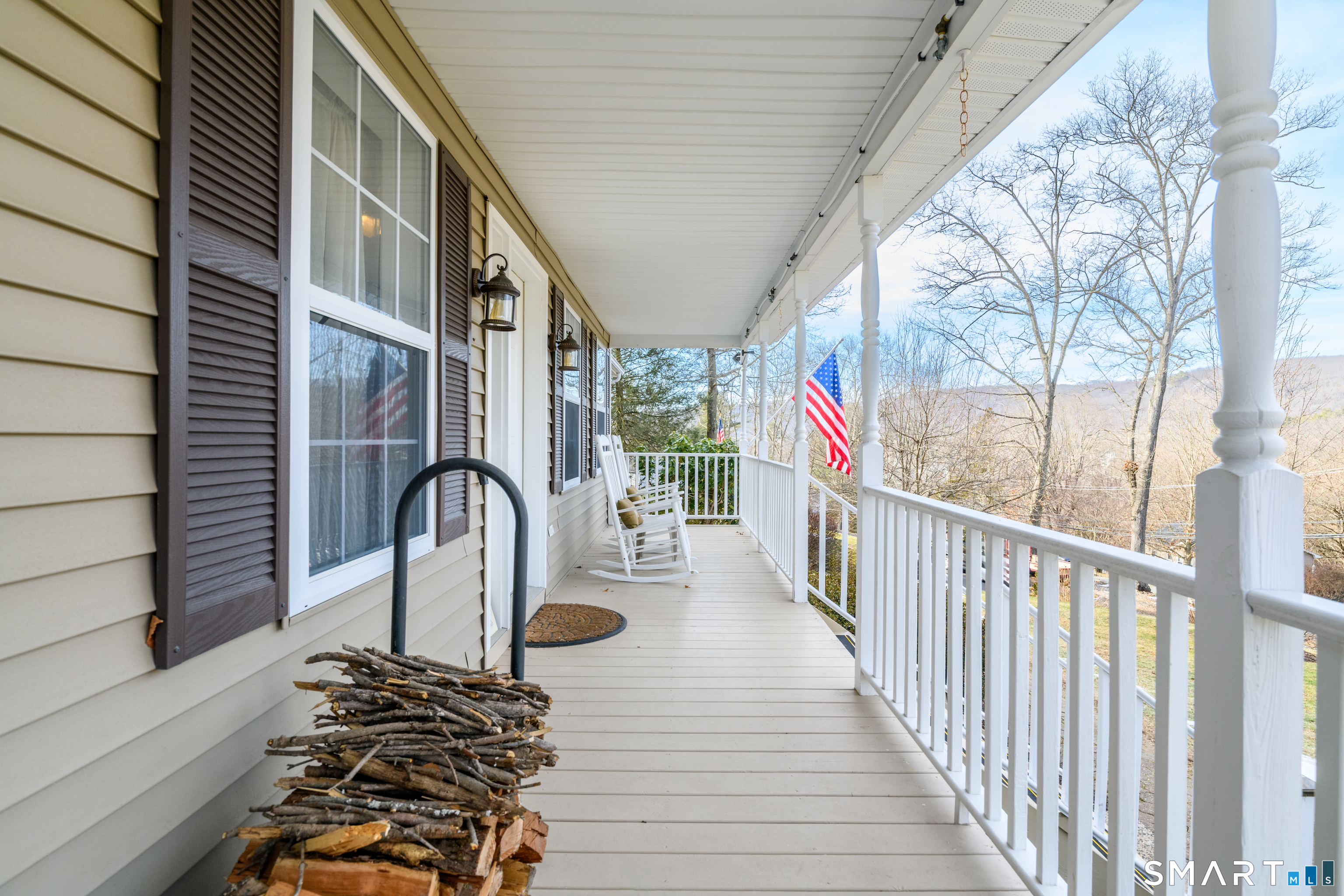 138 Burton Road Beacon Falls, CT 06403 - Photo 10 of 40 a balcony view with chairs and wooden floor