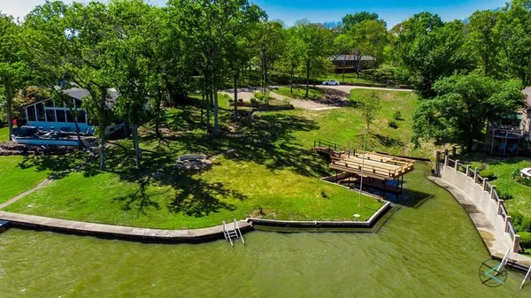 a view of a swimming pool with a yard