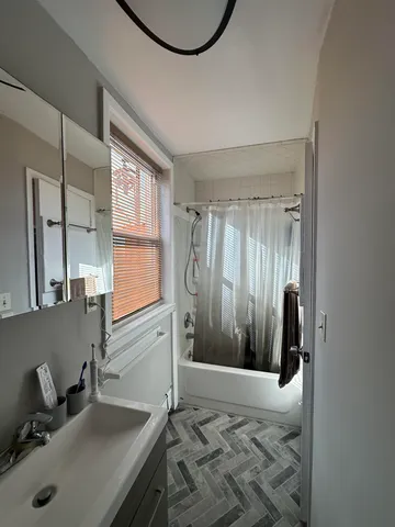 a bathroom with a sink and a mirror