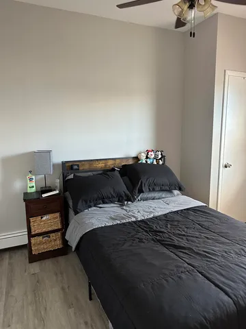 a bedroom with a bed and window