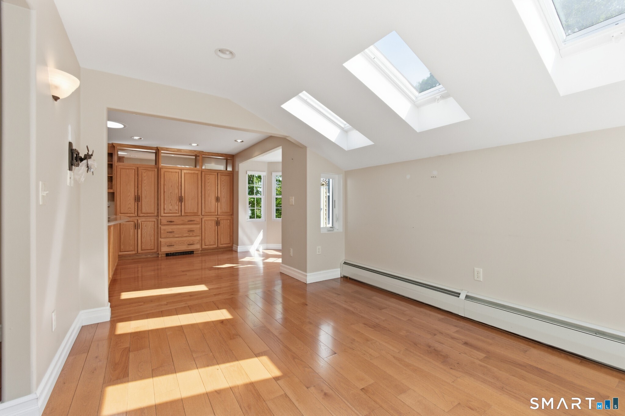 70 Mahoney Road Colchester, CT 06415 - Photo 10 of 40 an empty room with wooden floor and windows