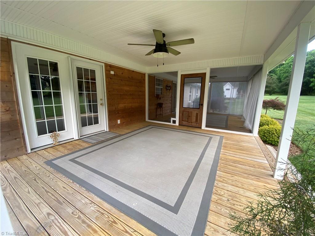 229 Dublin Road Advance, NC 27006 - Photo 34 of 41 covered porch with doors to kitchen dining area