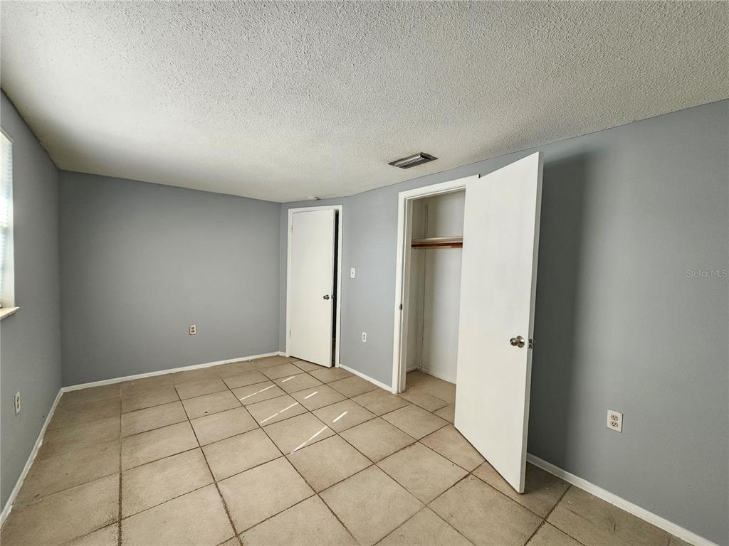 7825 Sagebrush Drive Port Richey, FL 34668 - Photo 13 of 17 a view of an empty room