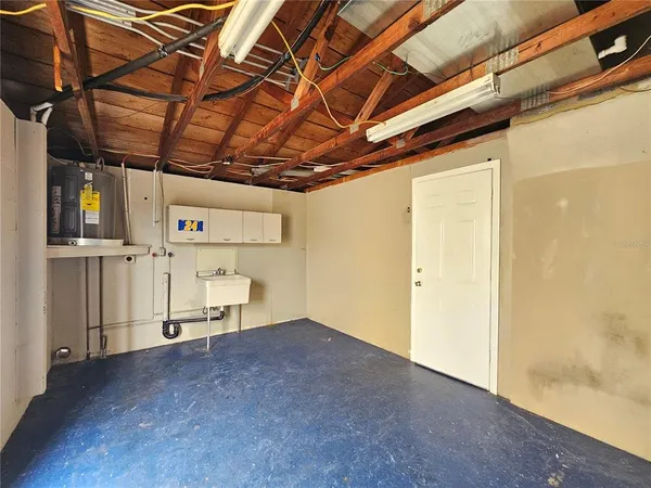 a view of empty room with wooden walls