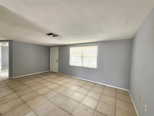 a view of an empty room and window