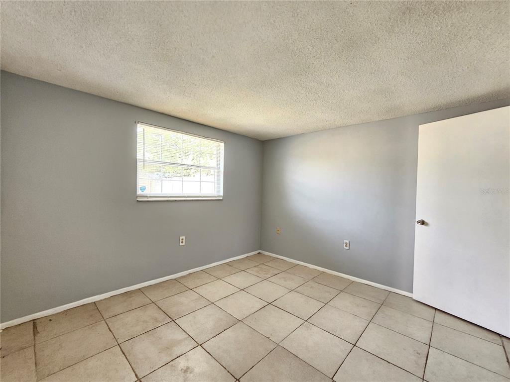 7825 Sagebrush Drive Port Richey, FL 34668 - Photo 9 of 17 a view of room with window
