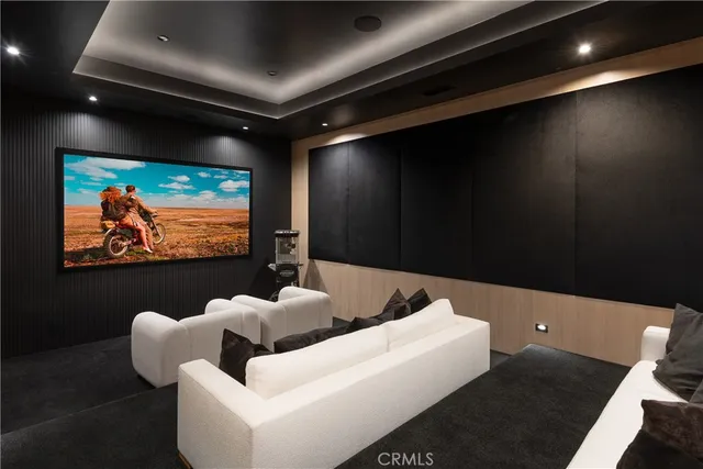 a living room with furniture fireplace and flat screen tv