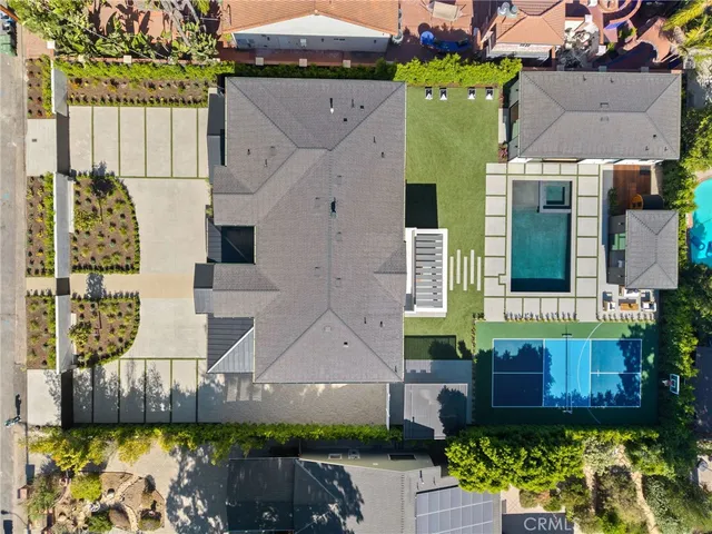 a view of swimming pool with red chairs