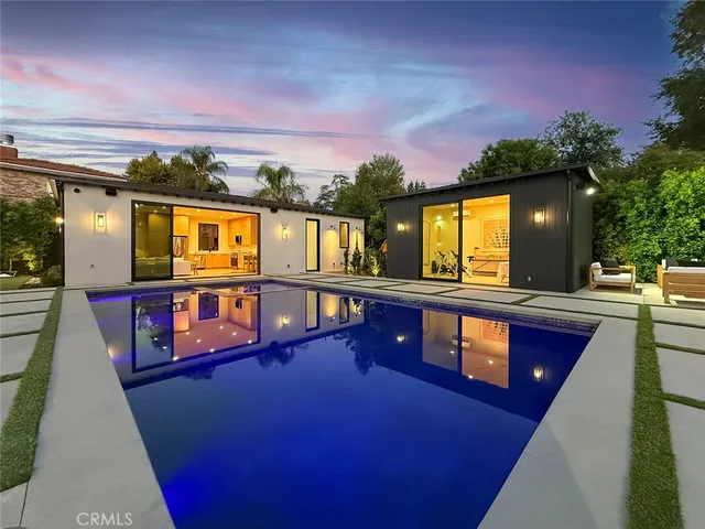 a projector room with furniture and a projector screen