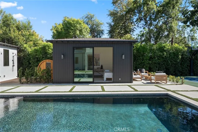 a bedroom with bed and wooden floor
