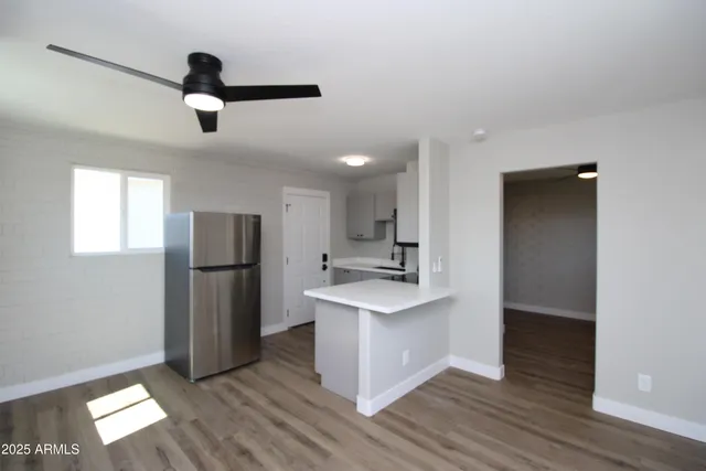 a kitchen with stainless steel appliances a refrigerator and a sink