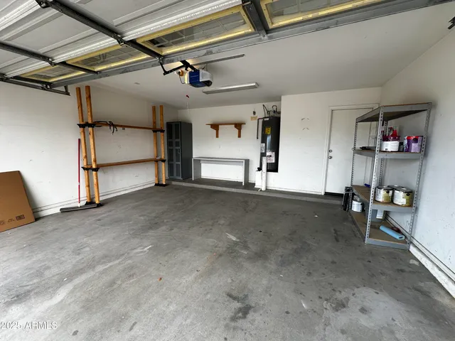 a view of a livingroom with furniture and a ceiling fan