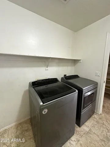 a utility room with washer and dryer