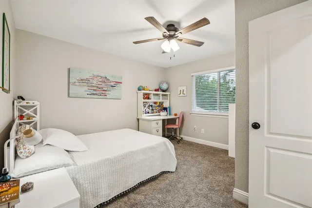 a view of swimming pool with outdoor seating and a garden