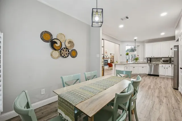 a living room with furniture and a book shelf
