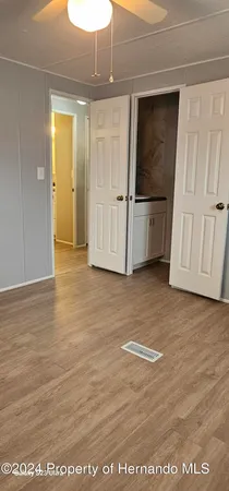 a view of a bathroom with mirror