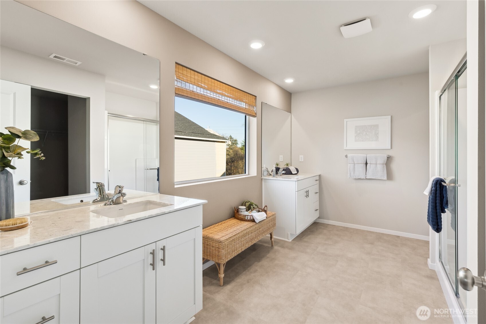 201 Cremini Loop Southeast, Unit 53 Lacey, WA 98513 - Photo 15 of 16 a spacious bathroom with a double vanity sink and mirror