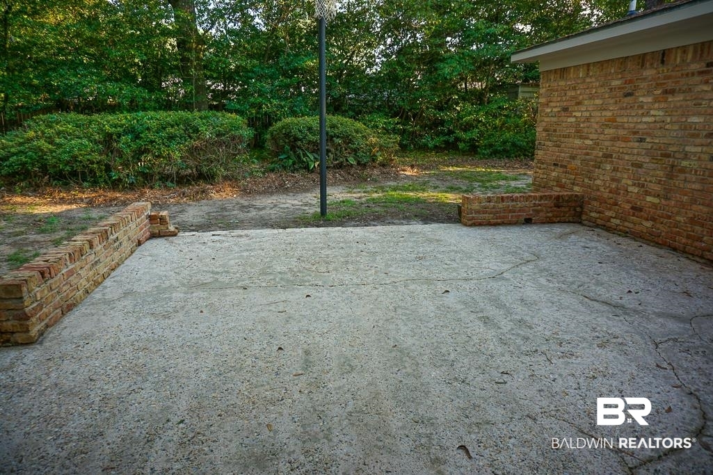 6205 Zeigler Boulevard Mobile, AL 36608 - Photo 16 of 17 View of patio featuring view of scattered trees