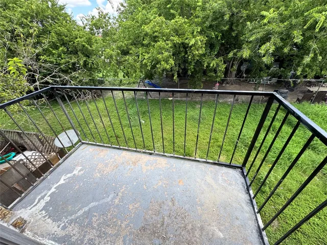 a view of swimming pool from a balcony