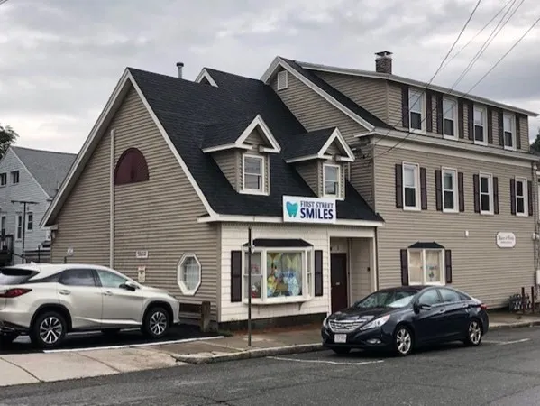 a car parked in front of a house