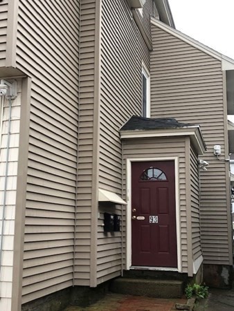 93 Main Street, Unit 3 North Andover, MA 01845 - Photo 2 of 11 a view of a house with large windows