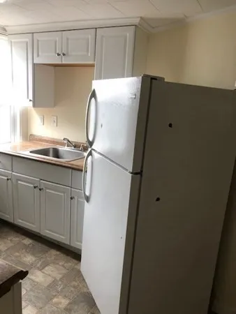 a bathroom with a sink and mirror