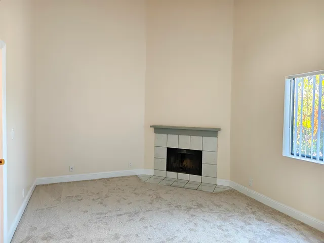 a view of a balcony with wooden fence