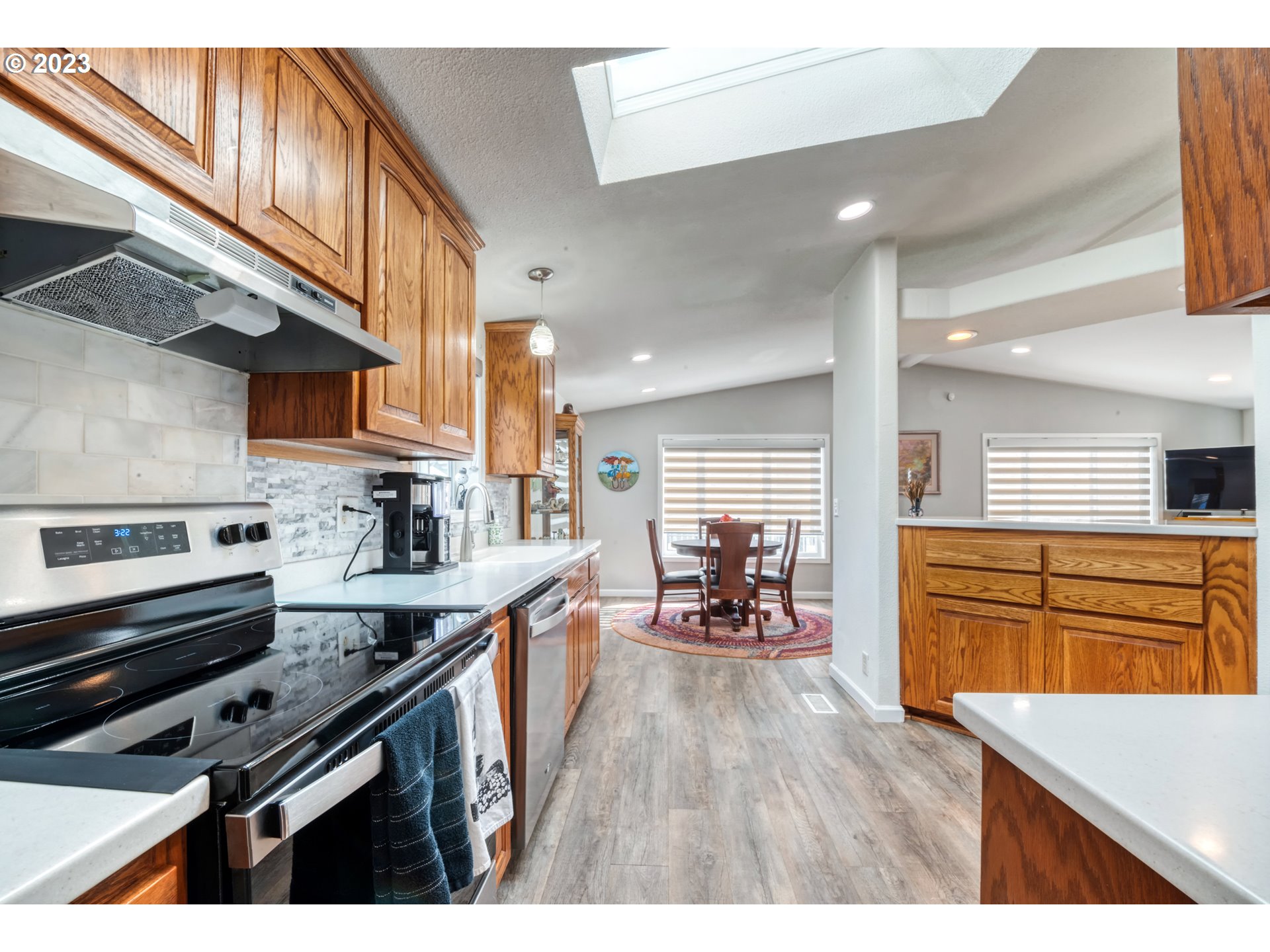 2580 Maia Loop Springfield, OR 97477 - Photo 12 of 29 a kitchen with wooden floors and appliances