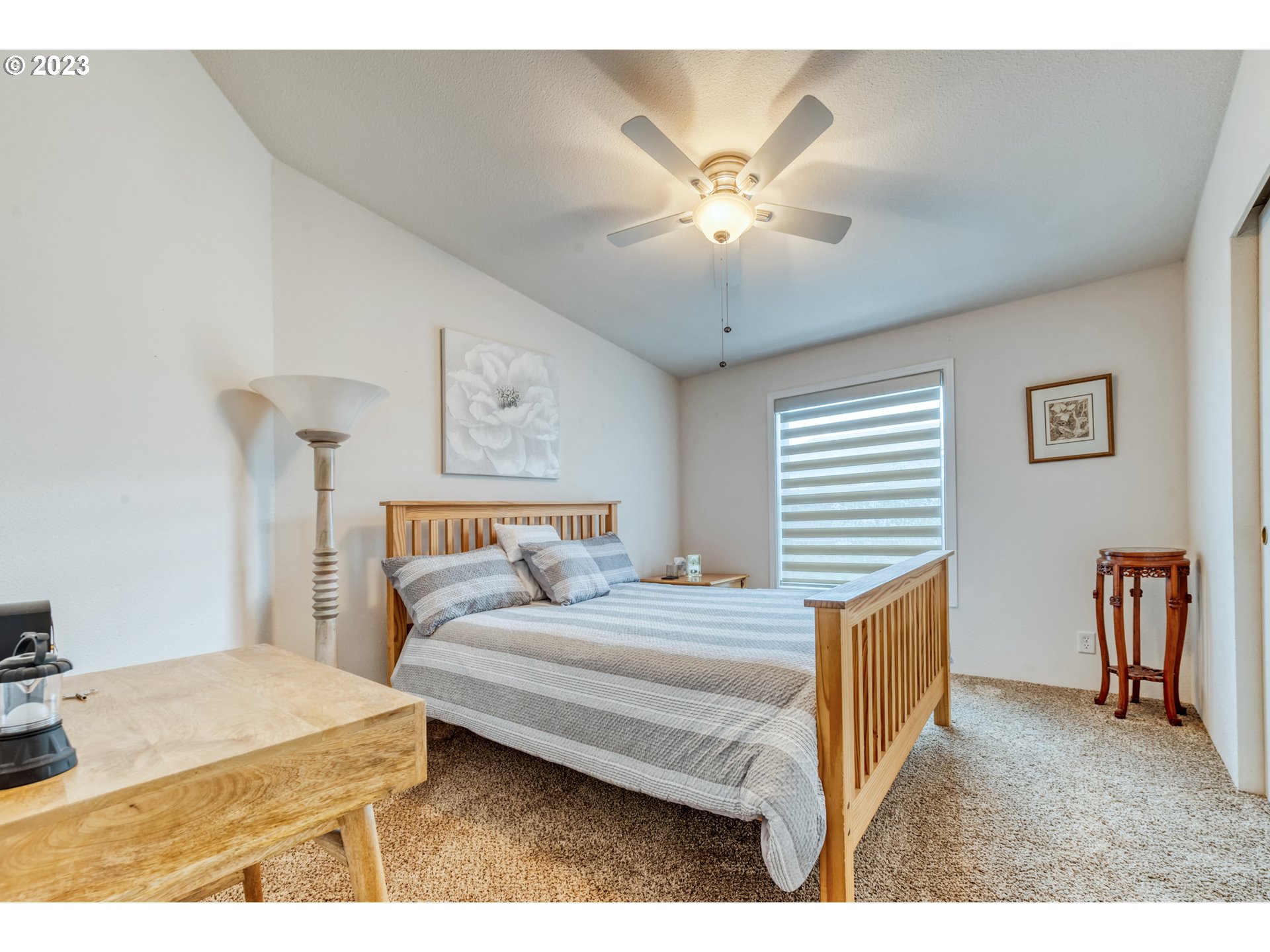 2580 Maia Loop Springfield, OR 97477 - Photo 17 of 29 a bedroom with a bed and a chandelier