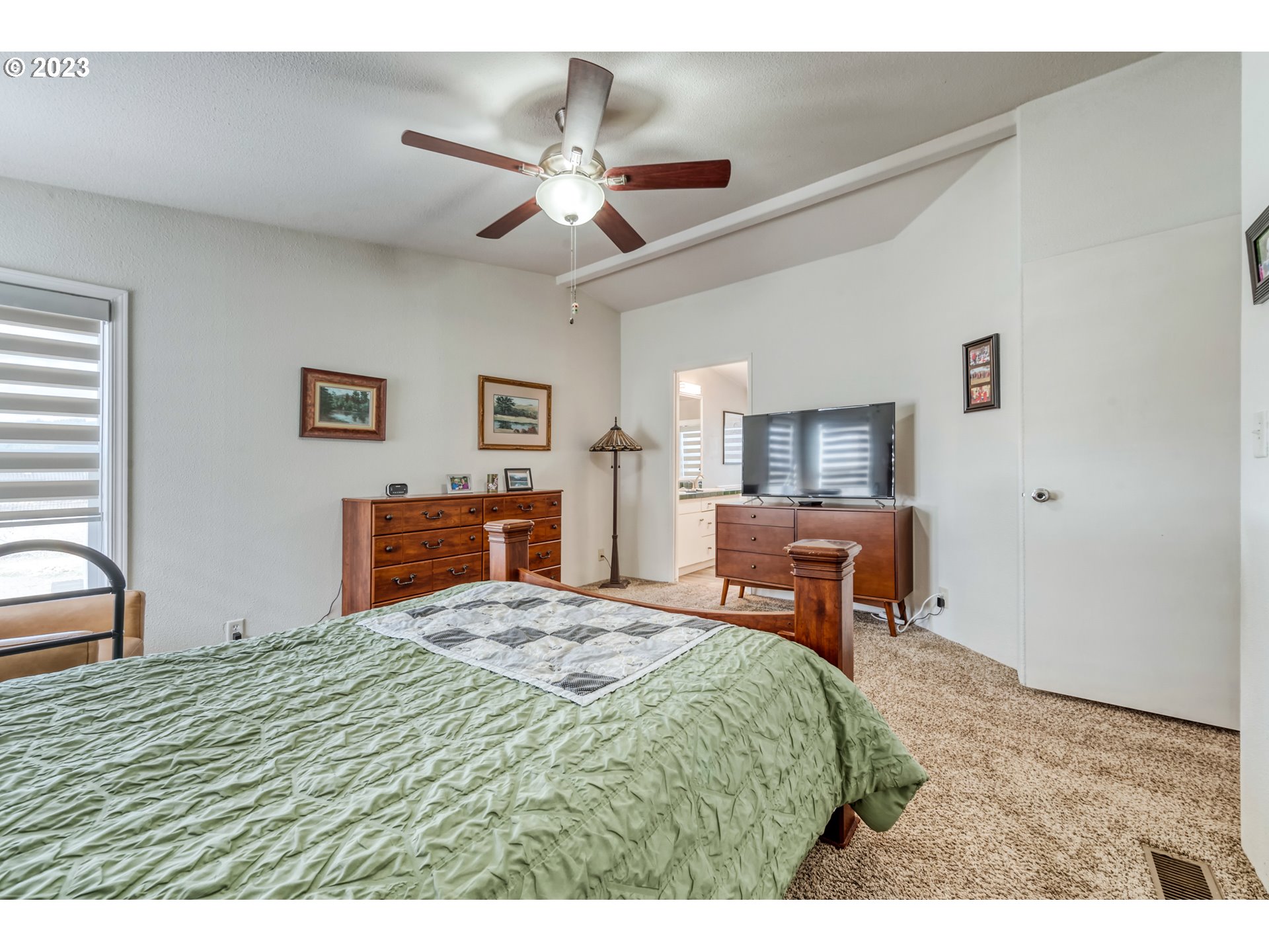 2580 Maia Loop Springfield, OR 97477 - Photo 19 of 29 a bedroom with a bed and wooden floor