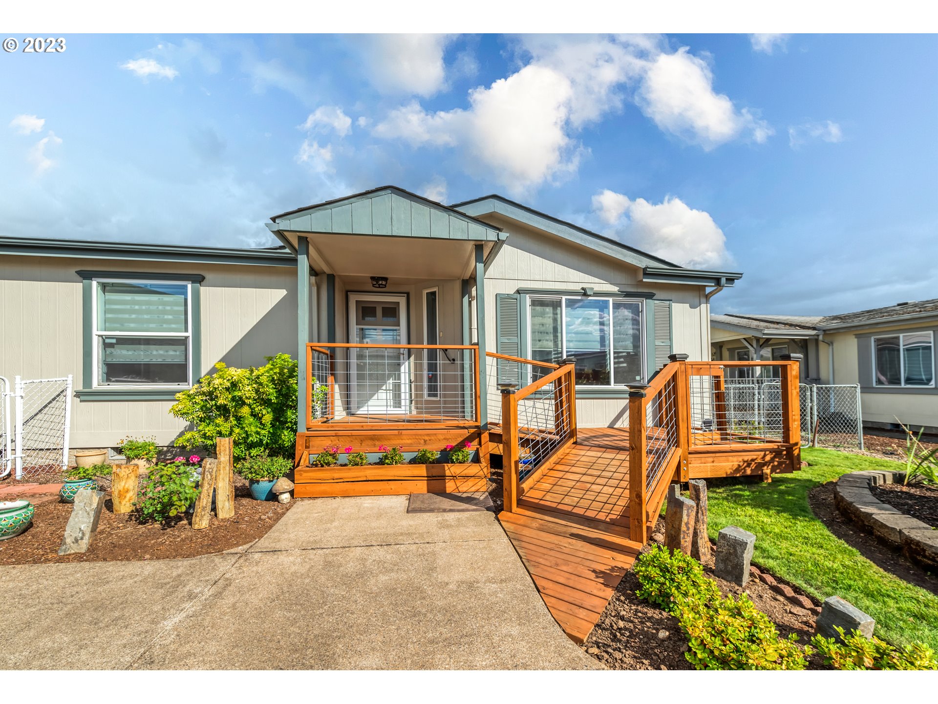 2580 Maia Loop Springfield, OR 97477 - Photo 2 of 29 a view of a house with backyard sitting area and garden