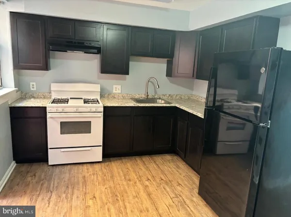 a kitchen with a sink and a stove