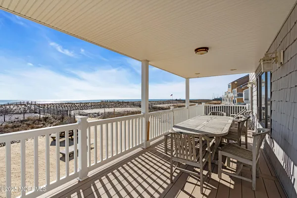 a view of a balcony with furniture